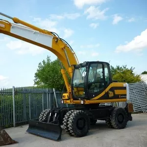 Услуги,  аренда,  заказ колесного экскаватора...